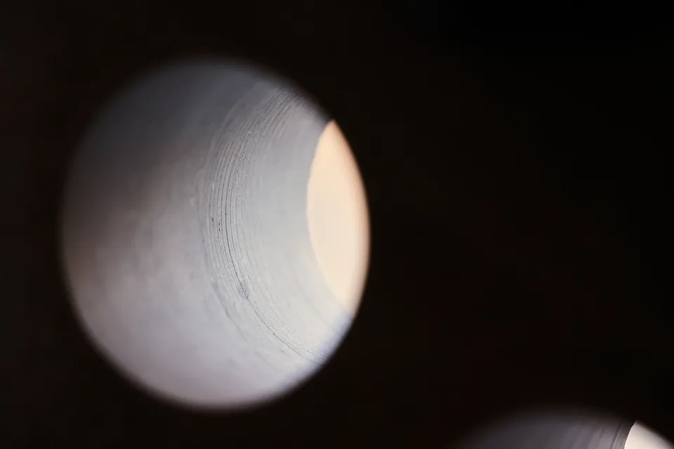 The ringed wall of a hole bored through limestone